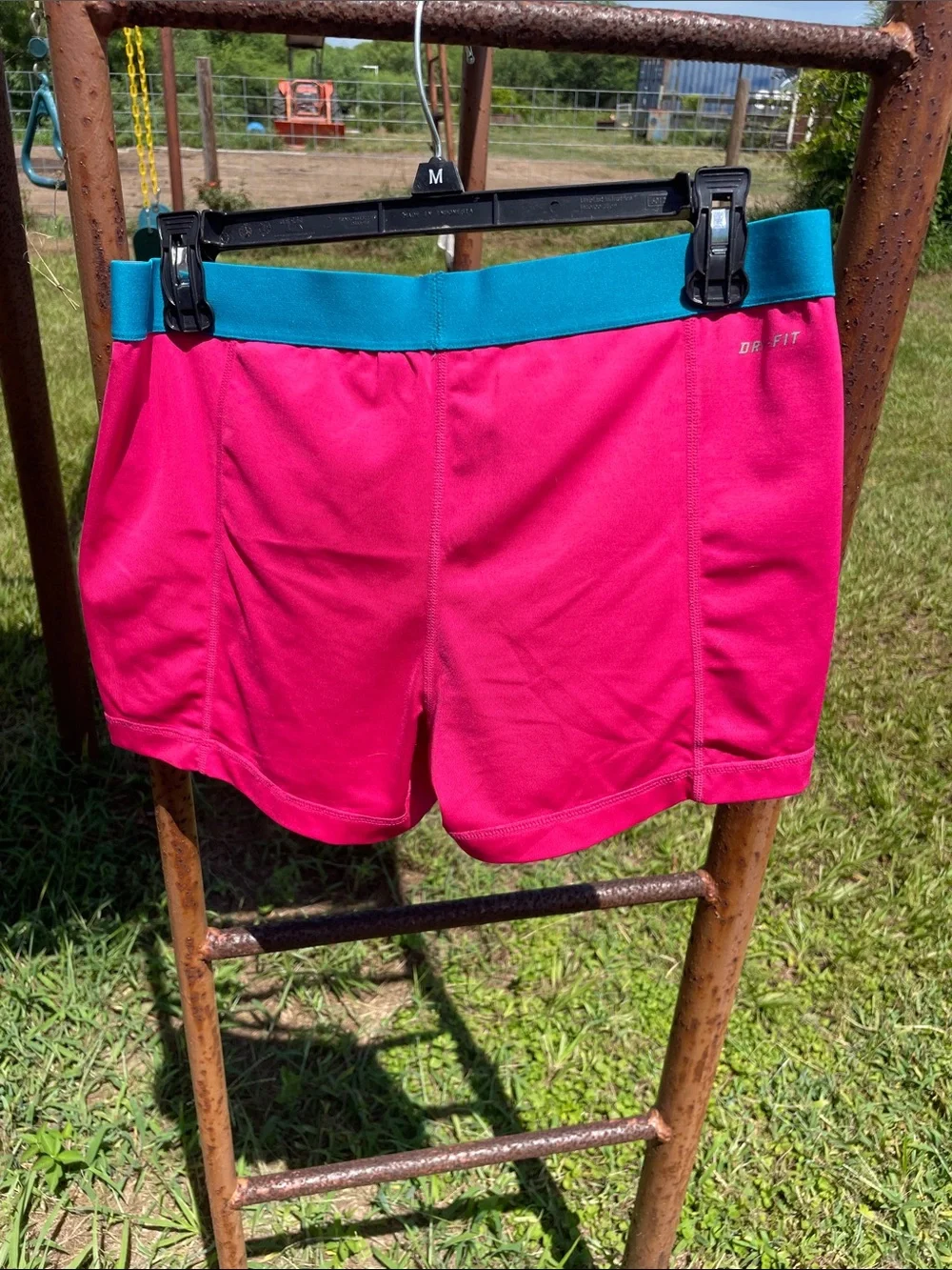 Nike Pro Women's Hot Pink Athletic Shorts with Teal Waistband